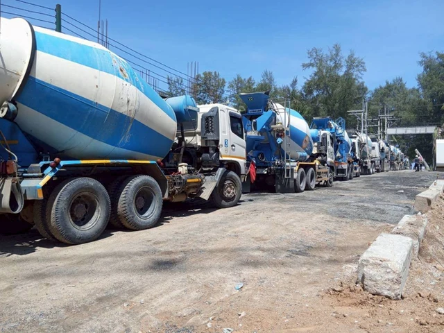 Line of concrete mixer trucks waiting to pour, Phuket